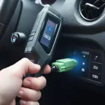 OBD-II Scanner Connecting to Port