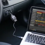 OBD2 USB adapter plugged into a car's OBD port, connected to a laptop displaying diagnostic software.