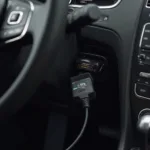 OBD2 VAG cable connected to a car's OBD2 port