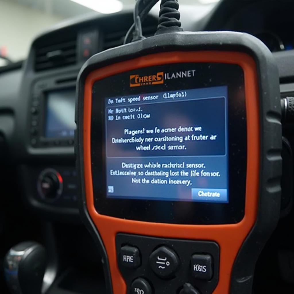 Display screen of an OBD2 scanner showing a wheel speed sensor related DTC