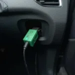 Super OBD2 Green Device Connected to a Car's OBD2 Port