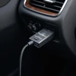 Torque OBD2 adapter plugged into a car's OBD2 port