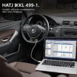 VAG KKL 409.1 cable connected to a car's OBD2 port and a laptop