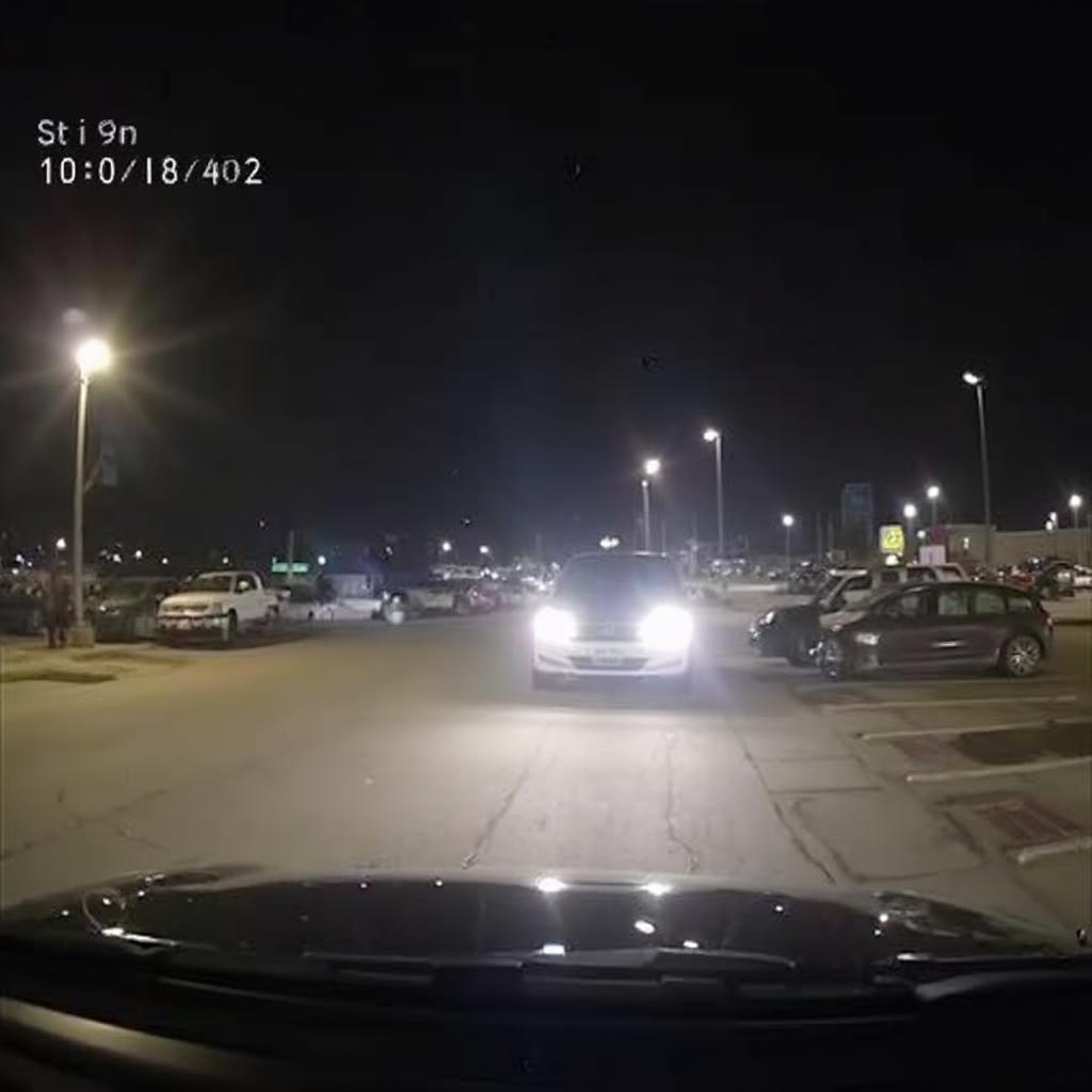 Vantrue T2 dash cam recording footage of a parking lot at night.