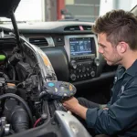 Mechanic Inspecting the OBD2 System in a 2010 Suburban