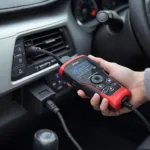 AD410 OBD2 Scanner connected to a Toyota Camry OBD2 port