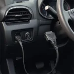 OBD2 cable connected to a car's diagnostic port