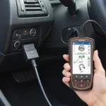 OBD2 Scanner Connected to Car